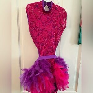 Vibrant Pink and Purple Sequin Dance Competition Outfit with Feather Details.